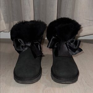 Black UGG boots with silk bows